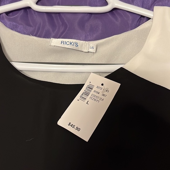 Ricki’s Asymmetrical Black and White Blouse Size Large NWT - Picture 4 of 5
